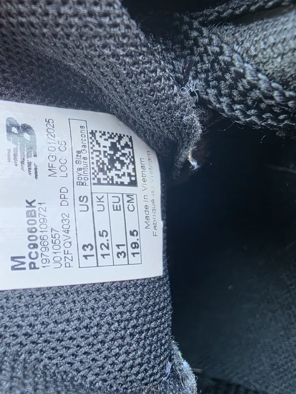 New Balance Black and Gray Kids Sneakers with Red Accent